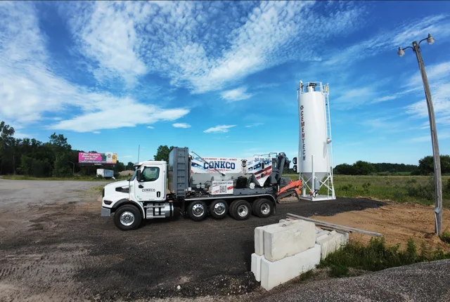 ConkCo Supply truck beside the silo